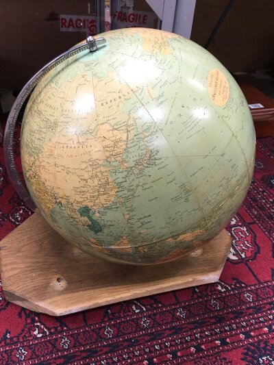 A large vintage London phillips challenge globe on an oak board, including old USSR before Russian federation. Globe 13 1/2" total high 42cm