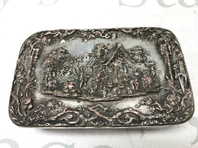 A silver plated box featuring a high-relief scene depicting a village scene.(Dimensions 4cm tall, 14cm wide approximately)- NO RESERVE