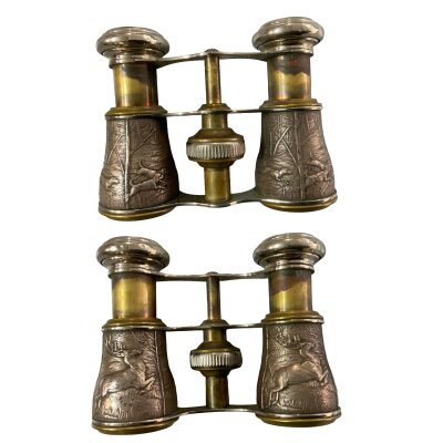 A small pair of vintage opera glasses, unmarked with white metal pressed hunting scenes.- NO RESERVE
