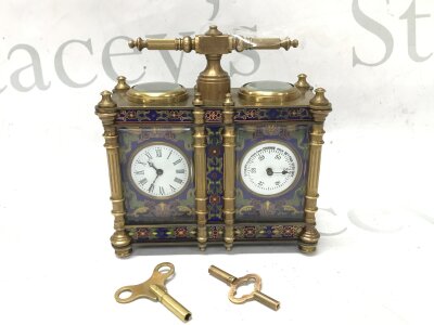A French brass and cloisonné clock barometer, 13.5cm tall 13cm wide.  Seen working.  Two keys