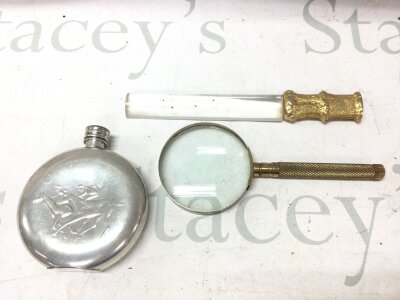 A glass page turner with gilt handle, magnifying glass