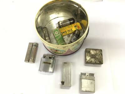A small collection of lighters etc.