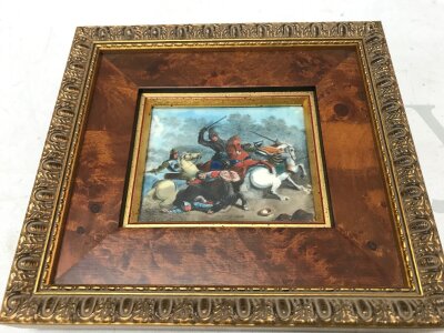 An 18th century ivory miniature depicting a cavalry battle scene, framed later. Frame size 18x16cm. Picture 9x7cm