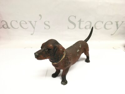 A German spelter table lighter in the form of a dog, approx length 24cm.