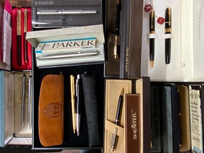 A good collection of modern and vintage Parker, Cross and Sheaffer ball point and fountain pens.