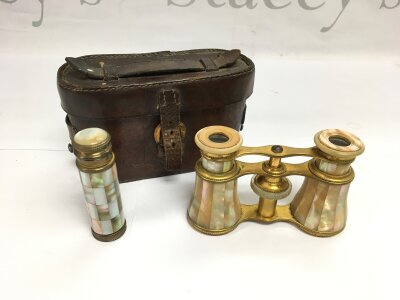 A cased pair of mother of pearl opera glasses and a matching perfume bottle (2).