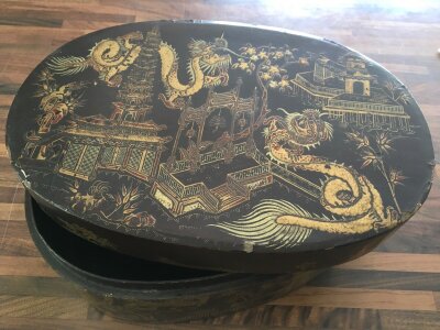 A Large paper mache lacquered box decorated with oriental scenes including Pagodas, dragons etc, together with an Indian wood block etc
