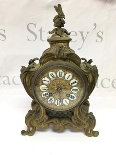 A French brass 8 day mantle clock with enamelled dial, approx height 30cm.- NO RESERVE