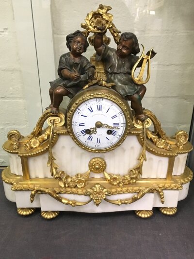 A French late 19th century bronze and gilt metal mantle clock, with key and pendulum