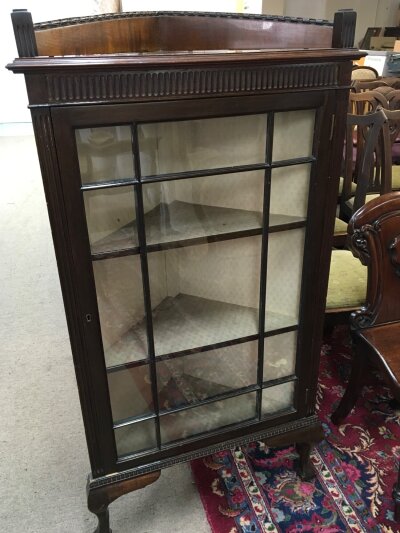 A Mahogany corner display cabinet with a single glazed door on ball and claw feet- NO RESERVE