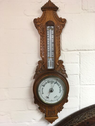 A oak carved barometer.- NO RESERVE