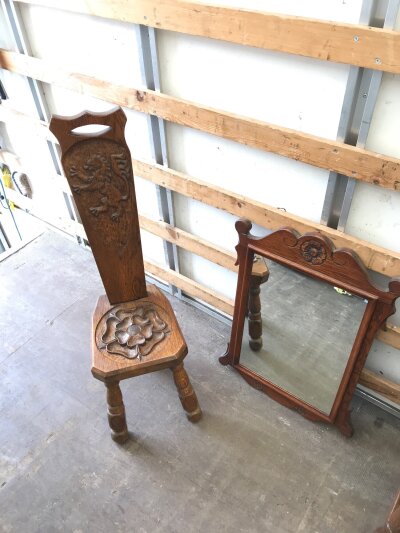 An oak wall mirror (52cm wide 70cm tall) and a carved oak corner chair (99cm tall)