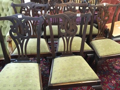 A set of six George III style dining chairs with open scroll backs and drop in seats on cabriole legs.- NO RESERVE