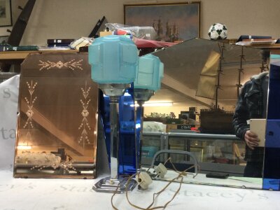 An Art Deco lamp and two mirrors. Dimensions 40x37 and 72x50cm