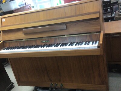 A Modern Walnut Kemble Piano serial number 181029. With three damper pedals. no sensible offer refused.