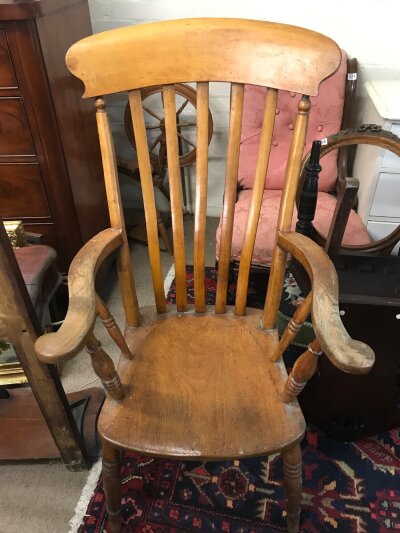 An elm Windsor comb back chair, 115cm tall, 60cm wide, 60cm long