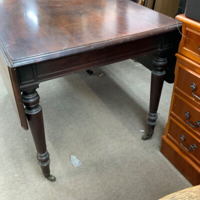 A 19th Century mahogany drop leaf table. 110cm x 133cm