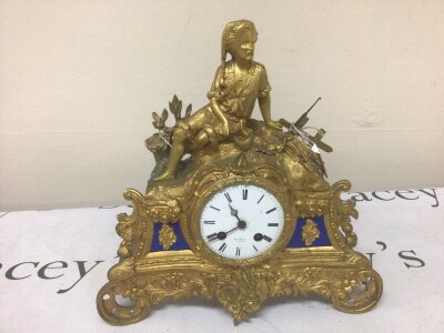A gilt mantle clock