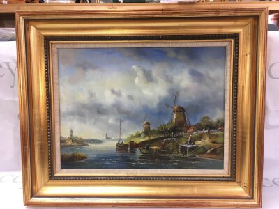 A 20th century oil painting Dutch scene river landscape with windmills, boats, and figures, by G.Schroter. Frame dimensions 54x44cm