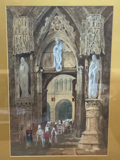 An interior view of a Gothic cathedral featuring elaborate tracery, monumental statues, and congregants gathered for service, after Samual Prout British, 1783–1852 (poss subject Regensburg). Gilt framed and glazed 69cm x 59cm