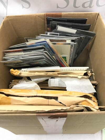 A box of stamps presentation packs