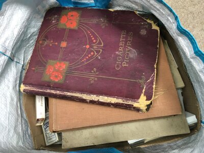 A bag of cigarette cards in albums and Loose including Players, Wills etc