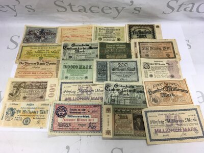 A collection of old German banknotes.