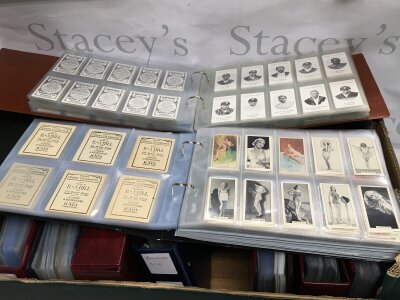 A box of cigarette cards and trading cards including reproduction examples by Taddy & Co, Godfrey Phillips, John Sinclair and others.