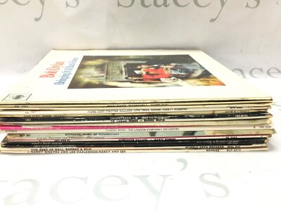 A collection of vinyl records including Bob Dylan, John Denver, Cliff Richard etc