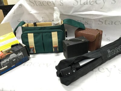 A collection of camera equipment including a tripod, box camera , canon bag and accessories
