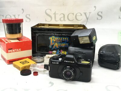 A miniature Pentax auto 110 50mm camera with extra lens and other accessories- NO RESERVE