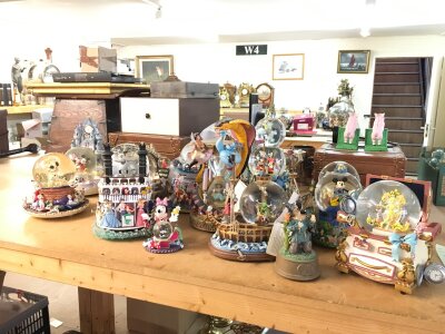 A collection of Disney snowglobes including Dumbo, Finding nemo, steam boat etc .No reserve