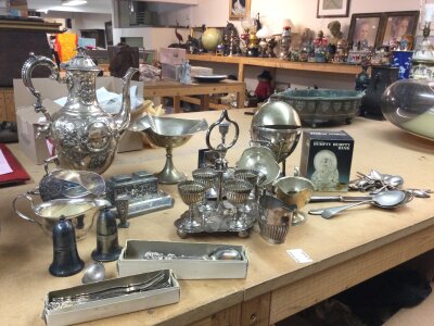 A collection of silver plate including spoons, forks, dragon Chinese style inkwell, teapot etc