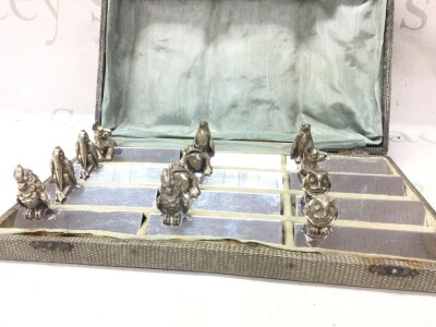 A cased set of 12 Art Deco silver plated knife rests