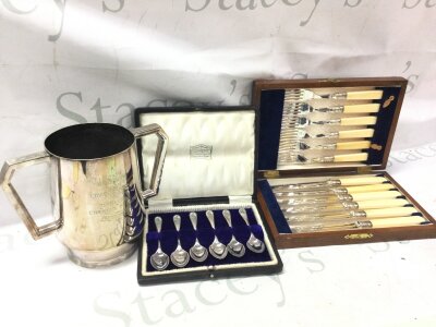 A silver plated trophy , cutlery set hallmarked silver spoons