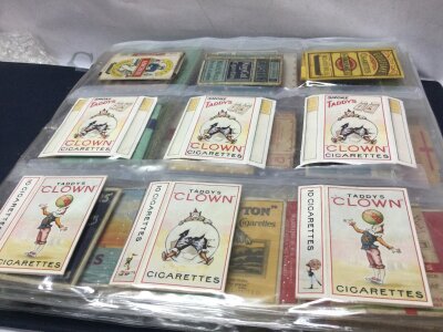 A collectors album containing 54 vintage cigarette packets including 6 Tandy’s clown