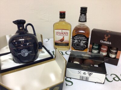 A single Malt Whisky bottled by Beinn Bhuidhe Orient Express Collection 75cl in a presentation box small bottles of Glenfiddich a Bottle of old Kentucky Bourbon and a bottle of Grouse.