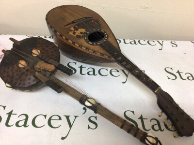 A West African Kora Lute skin covered with applied shells and a Vintage mandolin (2)
