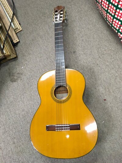 A classical guitar, Southend Guitar Centre label inside of soundhole. No case.