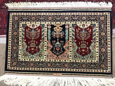 A small silk Turkish Hereke rug. 80x54cm