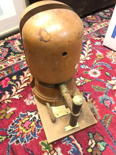 A hat block. 33cm tall 30cm long