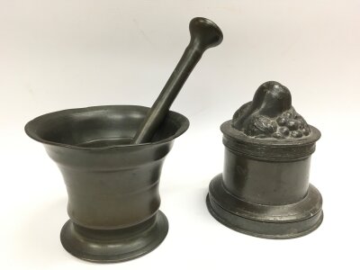 A small antique Mortar and pestle and a pewter jar and cover (12cm tall)
