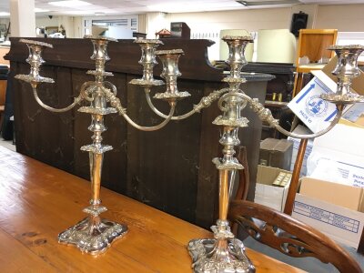 A pair or silver plated candlebras. 47cm tall