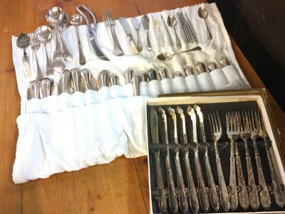 A collection of silver plated cutlery including forks, knives, spoons