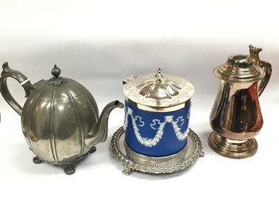 A Wedgwood biscuit barrel with silver plated lid and stand, pewter tea pot, silver plated tankard. Tallest 22cm