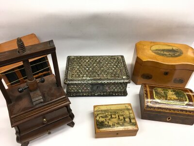 A collection of trinket boxes including a mother of pearl inlaid design box, a miniature linen press etc