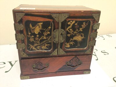 A Japanese lacquer cabinet with internal drawers Hight 22cm and a Continental cuckoo clock (2)