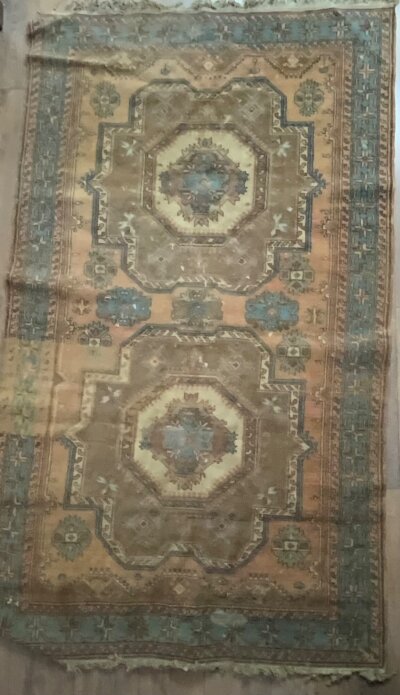 A small Persian rug 208cm x 120cm