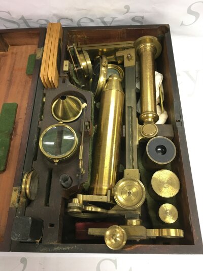 A 19th Century cased microscope and accessories.