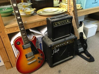 Three electric guitars an Eros les Paul style copy, Elena children's strat style and Squier Strat and two small practise amps a Park G10 and a CR101. No reserve